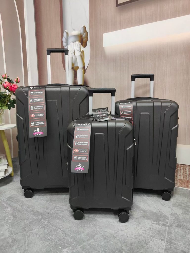 What material are the suitcases made in the Dongguan factory in China?